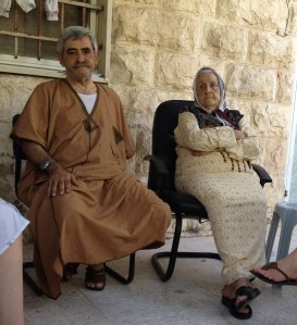 Nabil and his mother. Now without a house due to the settlers.